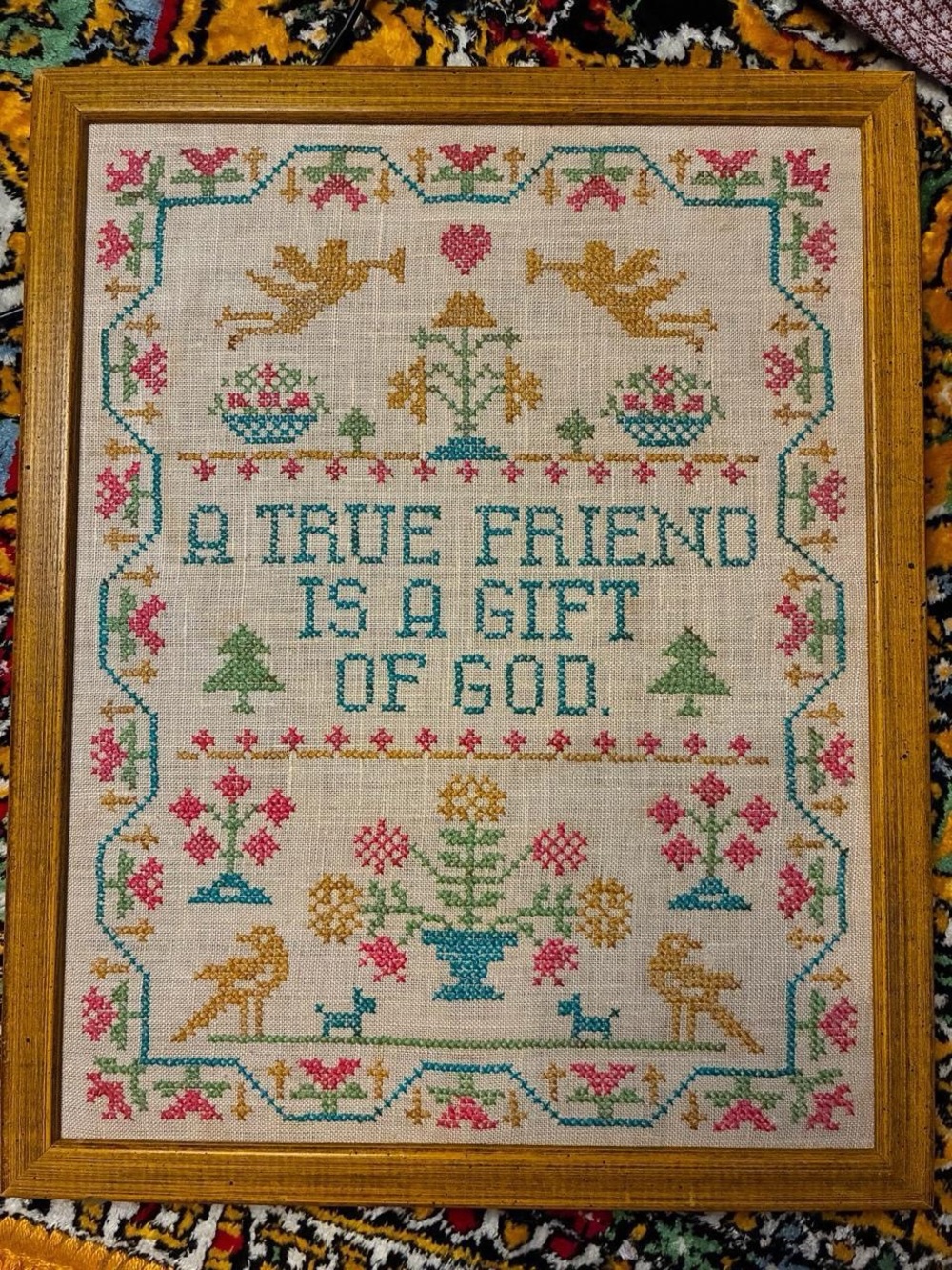 Vintage 1970s framed "A True Friend Is A Gift Of God" cross stitch.